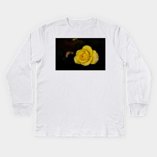 single yellow rose blossom on black background Kids Long Sleeve T-Shirt